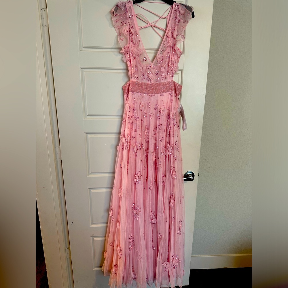 Beautiful in pink maxi dress with shiny beads.
